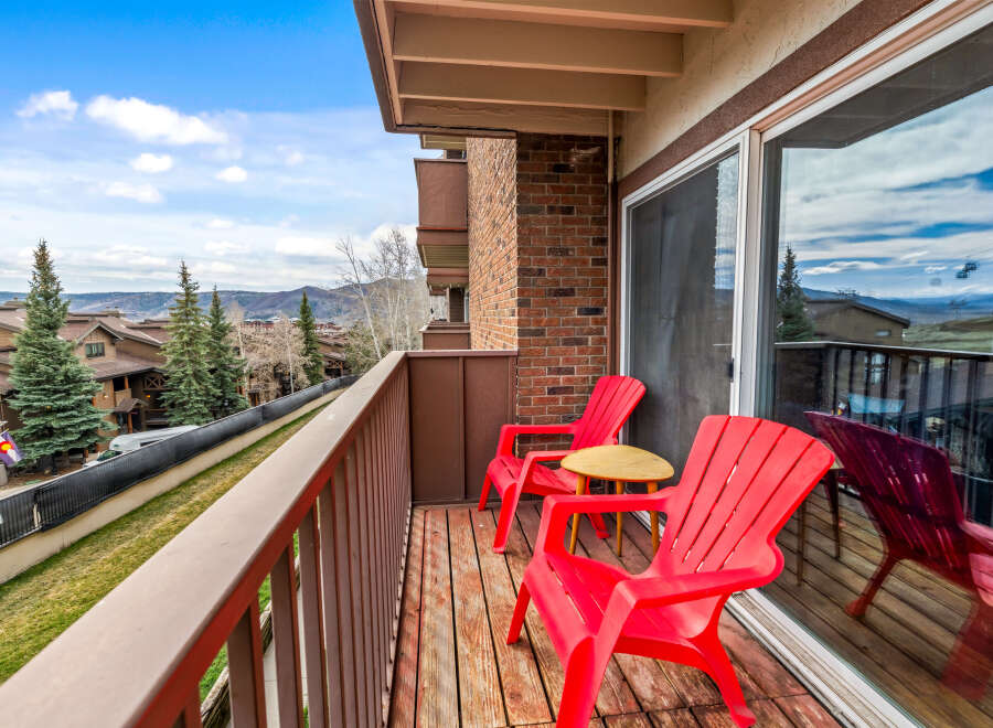 Enjoy breathtaking mountain views from this charming balcony.
