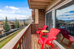 Enjoy breathtaking mountain views from this charming balcony.