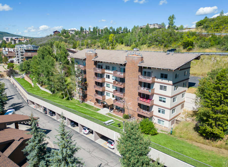 Discover luxury living in this stunning condo complex nestled in a picturesque mountain setting.