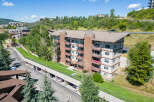 Discover luxury living in this stunning condo complex nestled in a picturesque mountain setting.