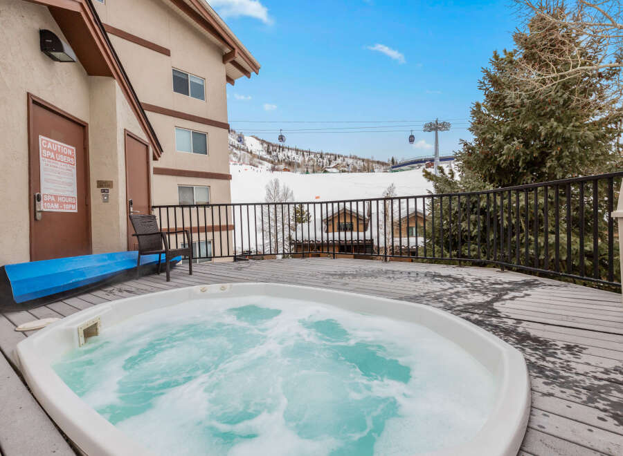 Relax and unwind in this luxurious hot tub, perfect for enjoying the stunning mountain views.