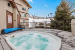 Relax and unwind in this luxurious hot tub, perfect for enjoying the stunning mountain views.