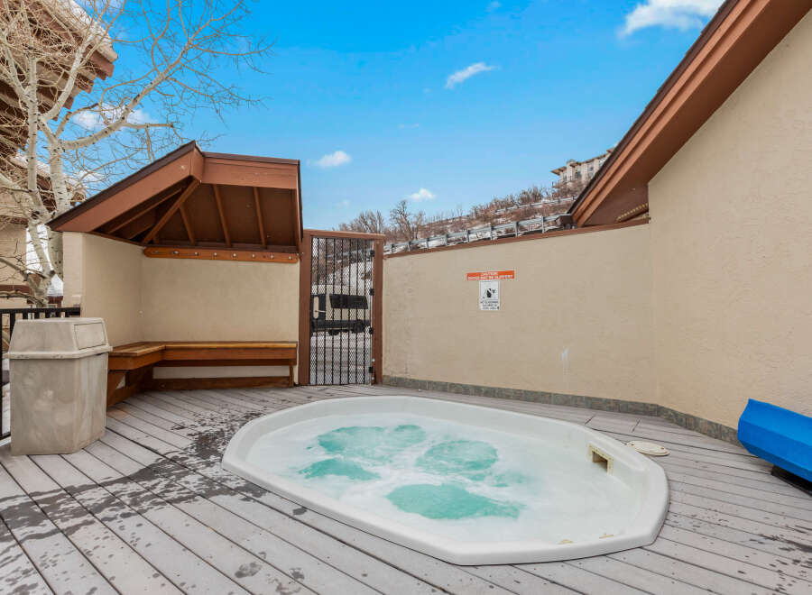Relax and unwind in this luxurious outdoor hot tub, perfect for enjoying the beautiful surroundings.
