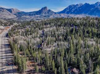 Nestled amidst the majestic mountains, this stunning property offers unparalleled views and a serene escape.