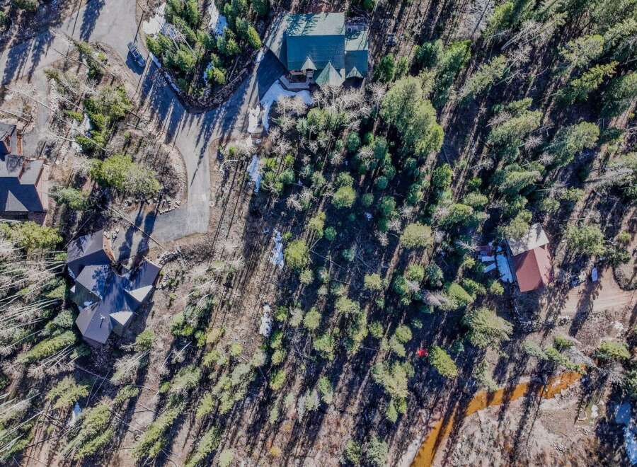 Discover a stunning mountain retreat nestled in a serene, wooded setting.