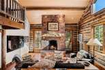 Step into rustic luxury with this stunning log cabin living room.