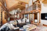 Step into luxury with this stunning log cabin home, boasting a grand open floor plan and exquisite wooden details throughout.