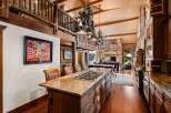 This stunning kitchen boasts a rustic yet elegant design, perfect for a luxurious mountain retreat.