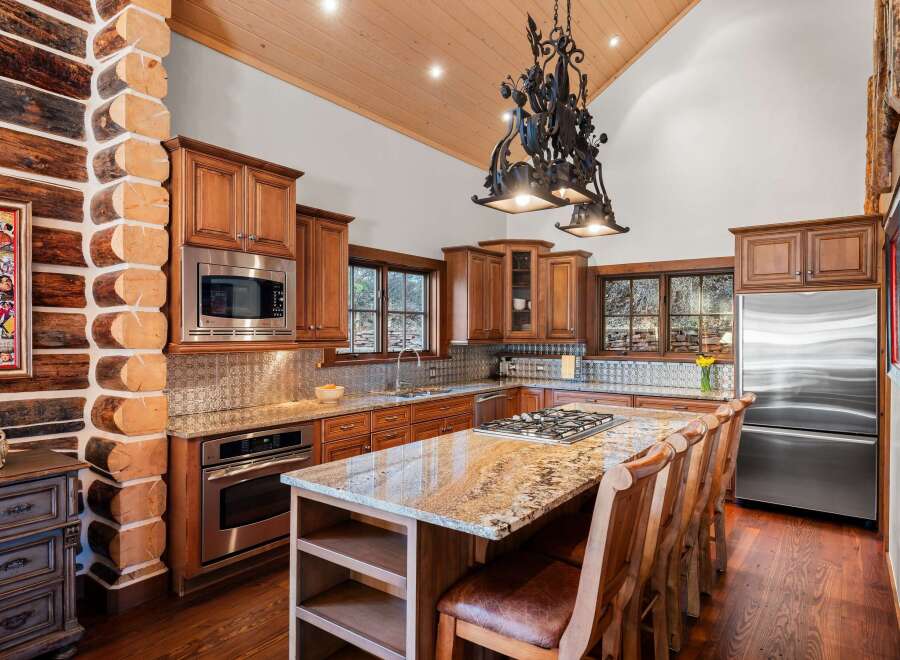 This stunning kitchen boasts a rustic yet elegant design, perfect for those seeking a unique and inviting space.