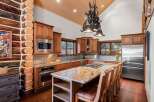 This stunning kitchen boasts a rustic yet elegant design, perfect for those seeking a unique and inviting space.