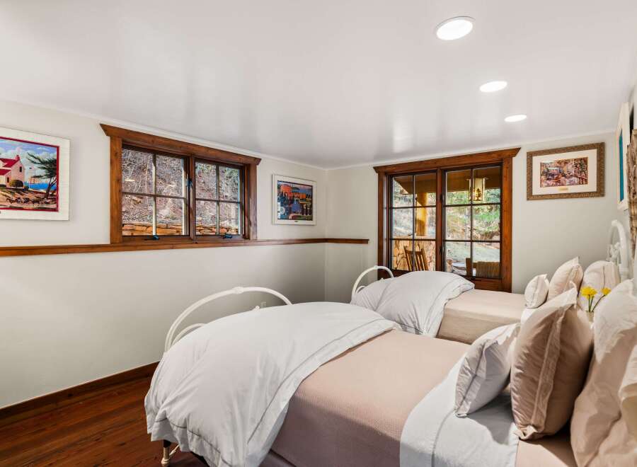This charming bedroom features two twin beds, perfect for guests or a cozy retreat.