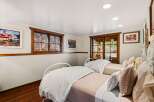 This charming bedroom features two twin beds, perfect for guests or a cozy retreat.