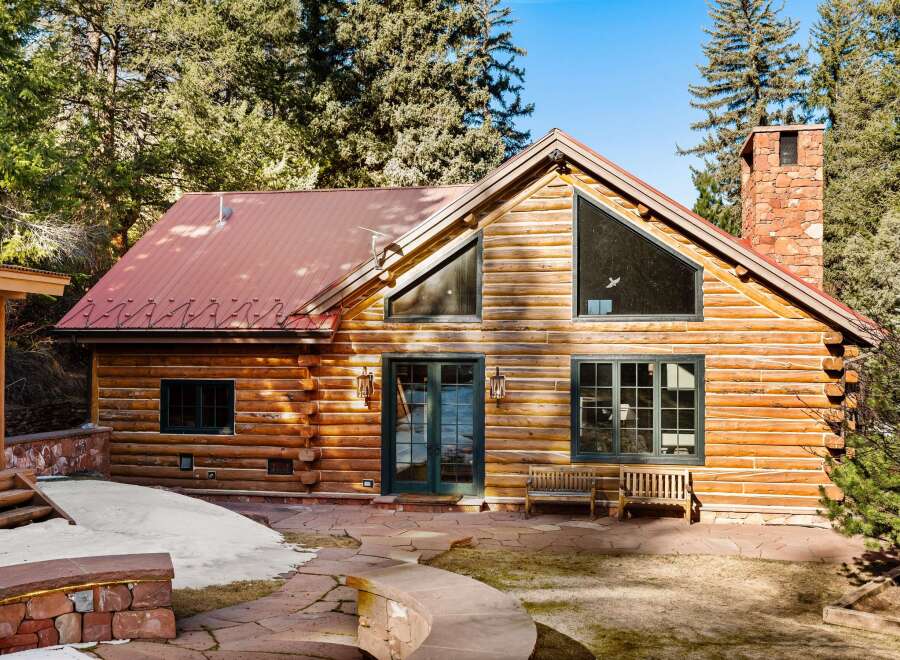 This stunning log cabin offers a perfect blend of rustic charm and modern comfort.
