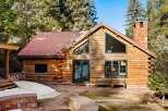 This stunning log cabin offers a perfect blend of rustic charm and modern comfort.