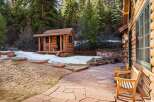Nestled in a serene natural setting, this property boasts a charming log cabin with a rustic aesthetic.