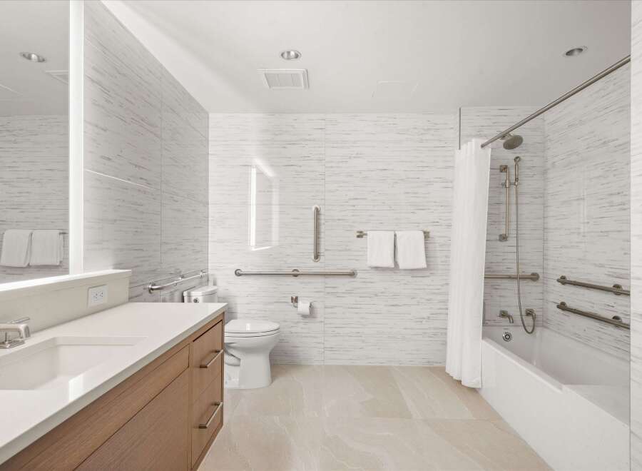 This modern bathroom features a sleek design with a focus on accessibility.