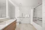 This modern bathroom features a sleek design with a focus on accessibility.