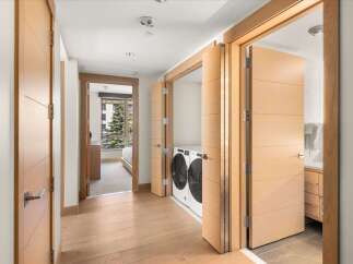 Step into luxury with this stunning property featuring exquisite wooden doors and a modern design.