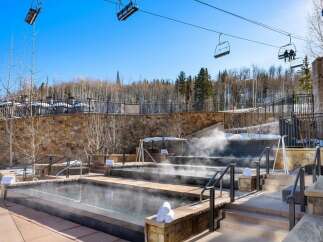 Experience ultimate relaxation at this luxurious property featuring multiple outdoor hot tubs.