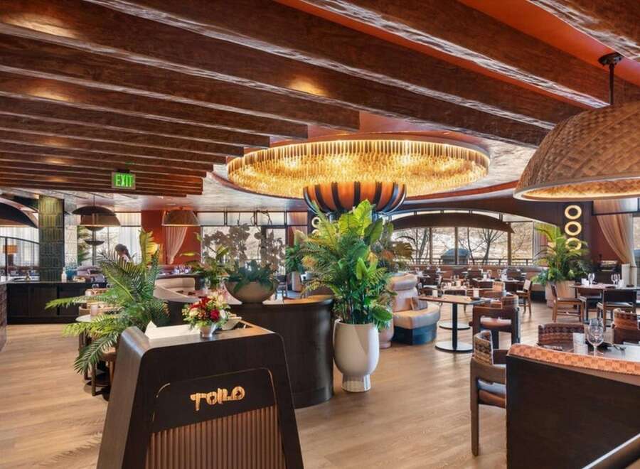 Step into the inviting ambiance of this stunning restaurant, showcasing a blend of modern design and natural elements.
