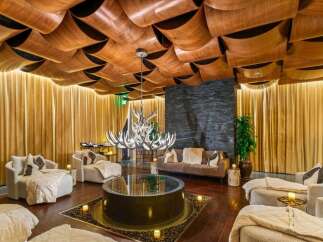 Step into luxury with this stunning property featuring a unique, artistic ceiling design.