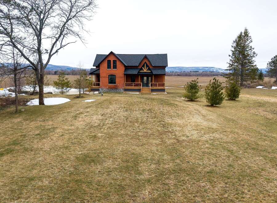 This stunning brick home offers a perfect blend of rustic charm and modern elegance.