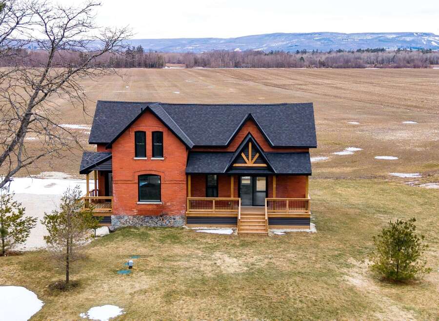 This stunning brick home offers a perfect blend of rustic charm and modern elegance.