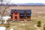 This stunning brick home offers a perfect blend of rustic charm and modern elegance.