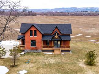 This stunning brick home offers a perfect blend of rustic charm and modern elegance.