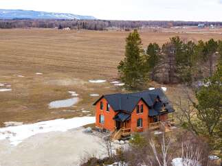 This stunning brick home offers a perfect blend of classic charm and modern comfort.