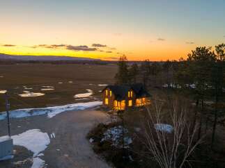 This stunning property offers a serene escape with its charming house and picturesque surroundings.