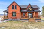 This stunning brick home offers a perfect blend of classic charm and modern design.