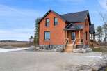 This stunning brick home offers a perfect blend of classic charm and modern elegance.
