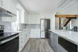 This stunning kitchen boasts modern design and high-end finishes.