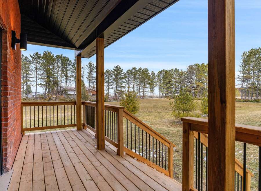 Enjoy the tranquility of this stunning property with a spacious porch, perfect for relaxing and taking in the beautiful views.