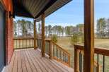 Enjoy the tranquility of this stunning property with a spacious porch, perfect for relaxing and taking in the beautiful views.