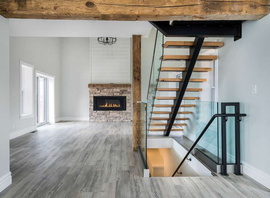 Step into luxury with this stunning modern home! Featuring a floating staircase, a cozy fireplace, and beautiful hardwood floors, this property offers a blend of elegance and comfort.