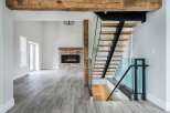 Step into luxury with this stunning modern home! Featuring a floating staircase, a cozy fireplace, and beautiful hardwood floors, this property offers a blend of elegance and comfort.