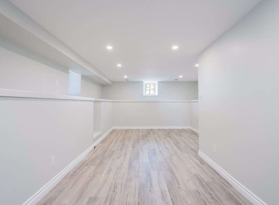 Step into this beautifully finished basement, offering a blank canvas for your dream space.
