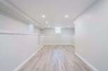 Step into this beautifully finished basement, offering a blank canvas for your dream space.