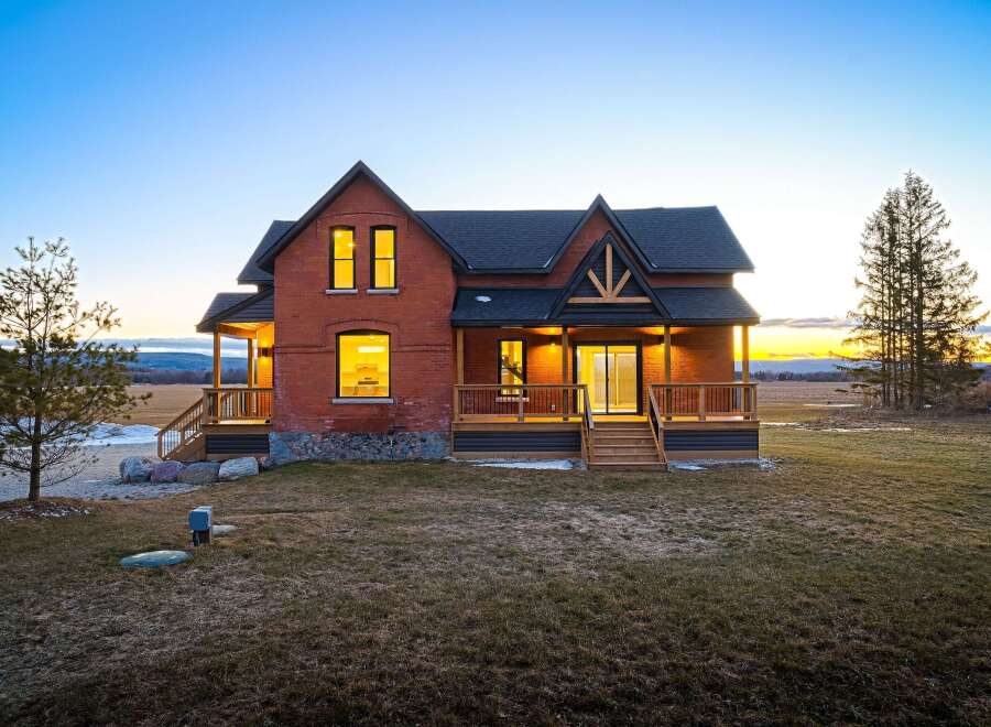 This stunning brick home offers a perfect blend of classic charm and modern amenities.