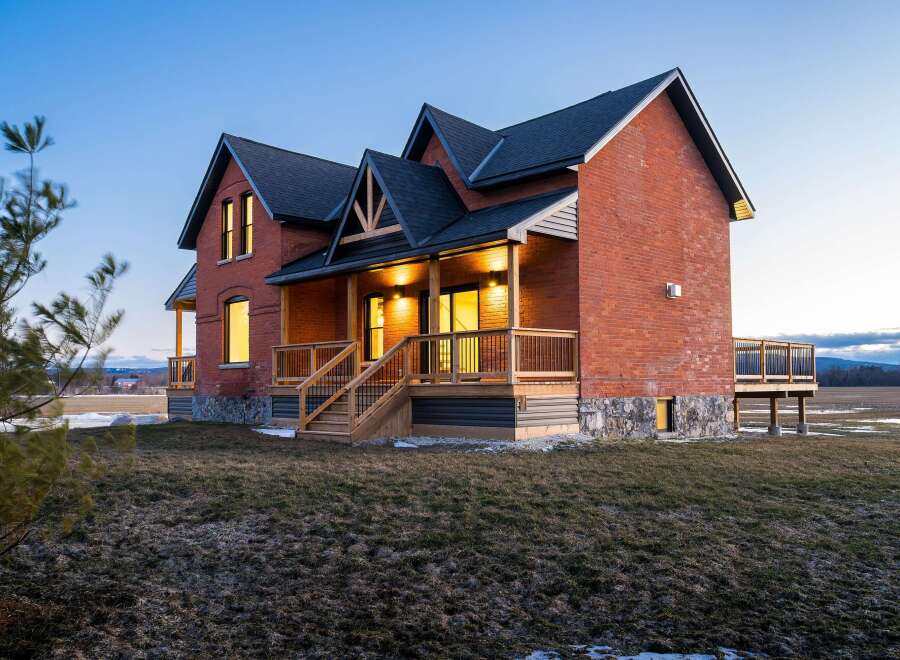 This stunning brick home offers a blend of classic charm and modern design.