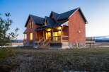 This stunning brick home offers a blend of classic charm and modern design.