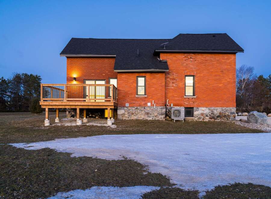 This stunning brick home offers a blend of classic charm and modern comfort.