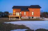 This stunning brick home offers a blend of classic charm and modern comfort.