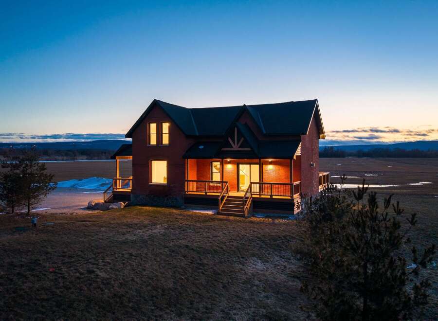 This stunning brick home offers a perfect blend of rustic charm and modern comfort.