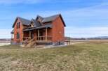 This stunning brick house offers a blend of classic charm and modern design, perfect for those seeking a unique property.