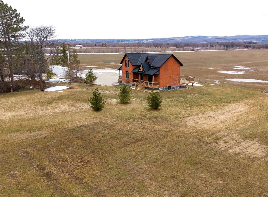 This stunning brick house offers a perfect blend of modern comfort and rustic charm.