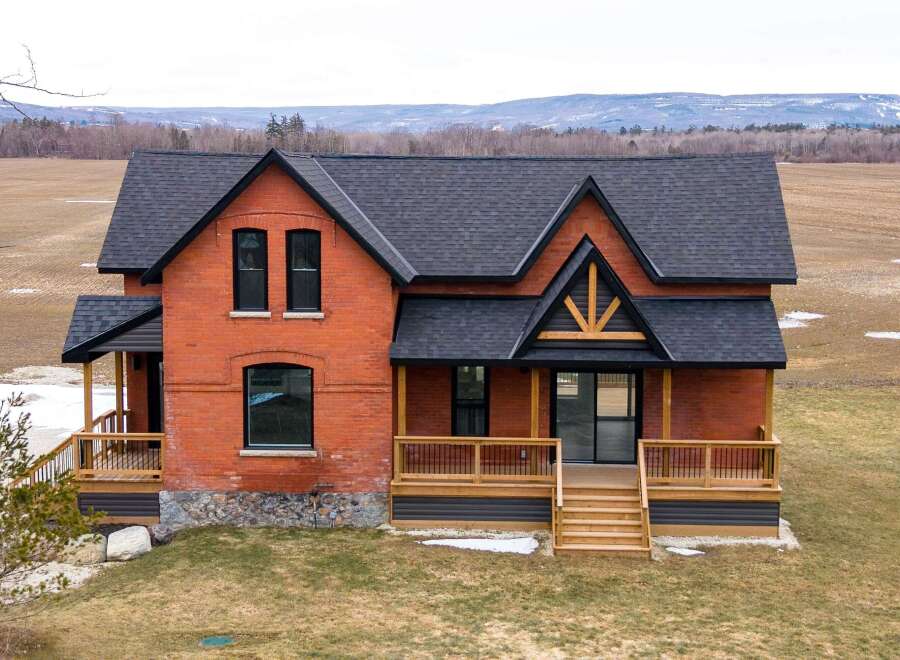 This stunning brick home offers a perfect blend of classic charm and modern design.