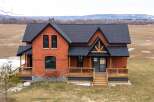 This stunning brick home offers a perfect blend of classic charm and modern design.